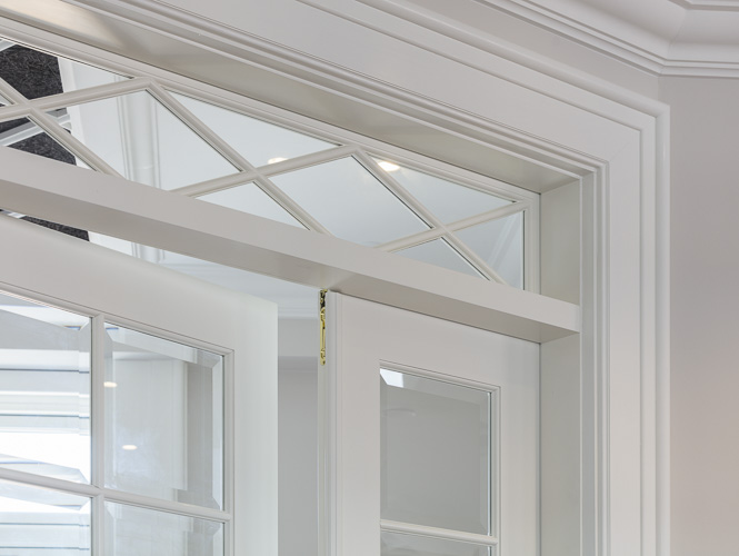 Classic French doors and transom with faceted glass